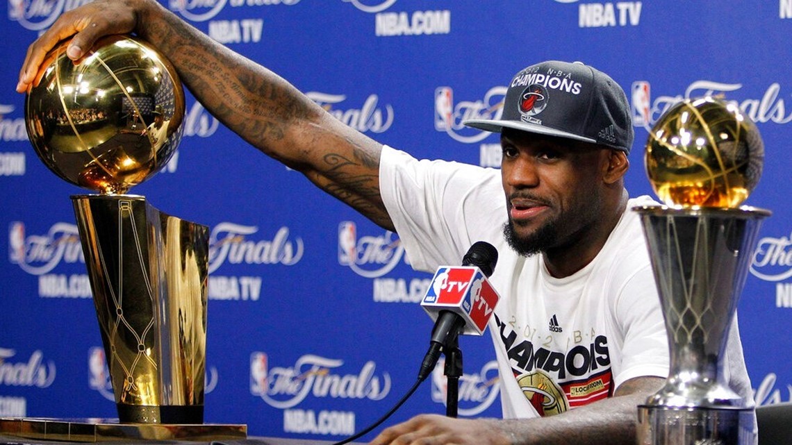 LeBron James wins his first NBA title as the Heat close out the