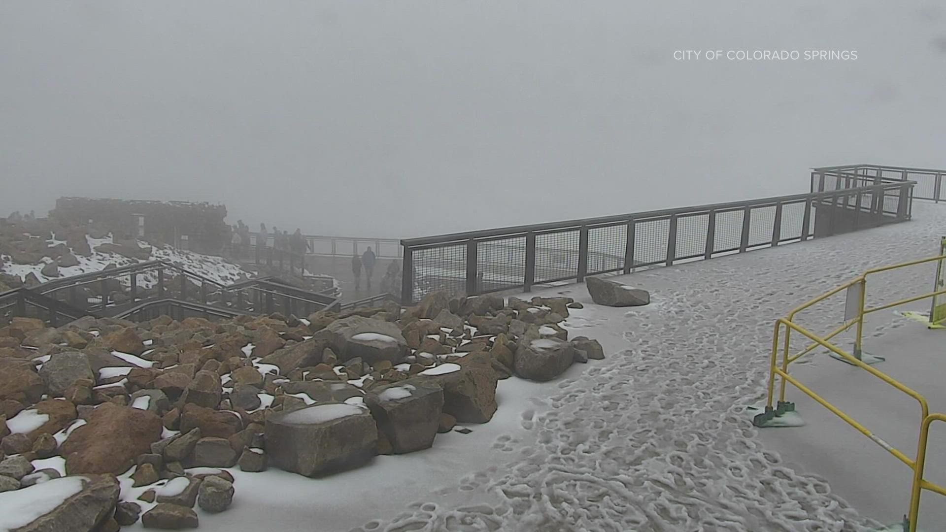 Pikes Peak, west of Colorado Springs, briefly got a dose of winter on Sunday, Aug. 21, 2022.