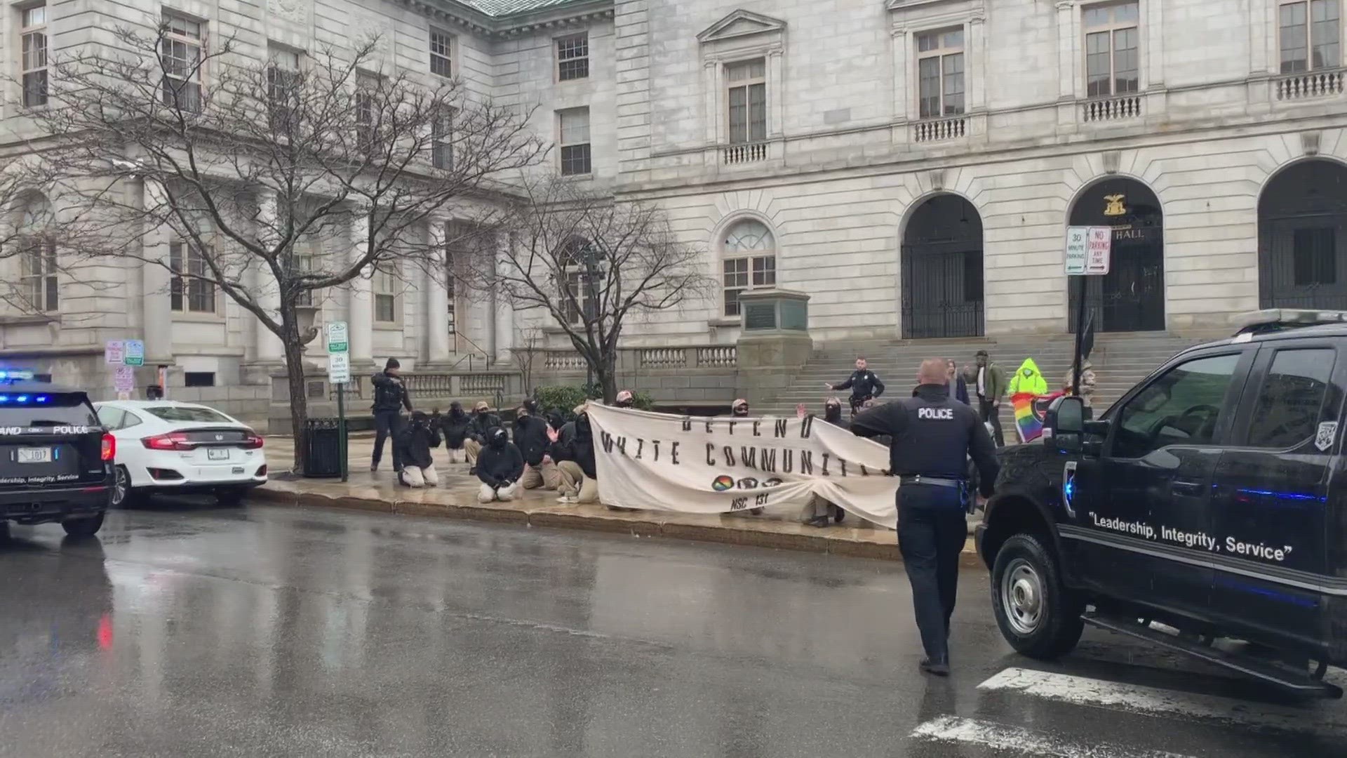 More than a dozen individuals with the group were seen marching and chanting throughout the city's downtown.